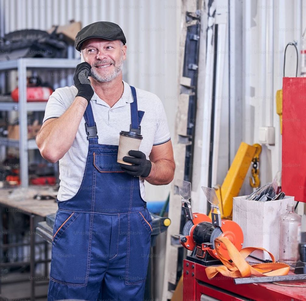 LIFT technician holding a bottle of full synthetic oil