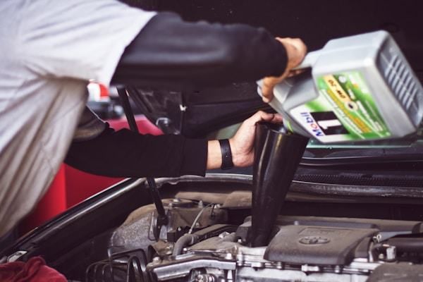 Technician replacing an oil filter
