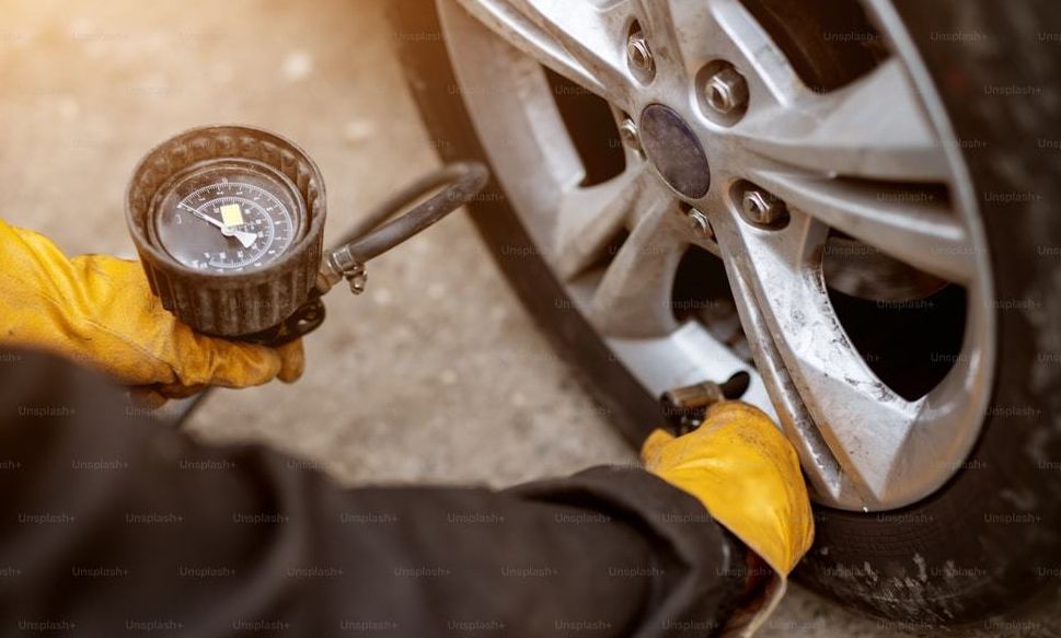 Tire pressure gauge on a car wheel
